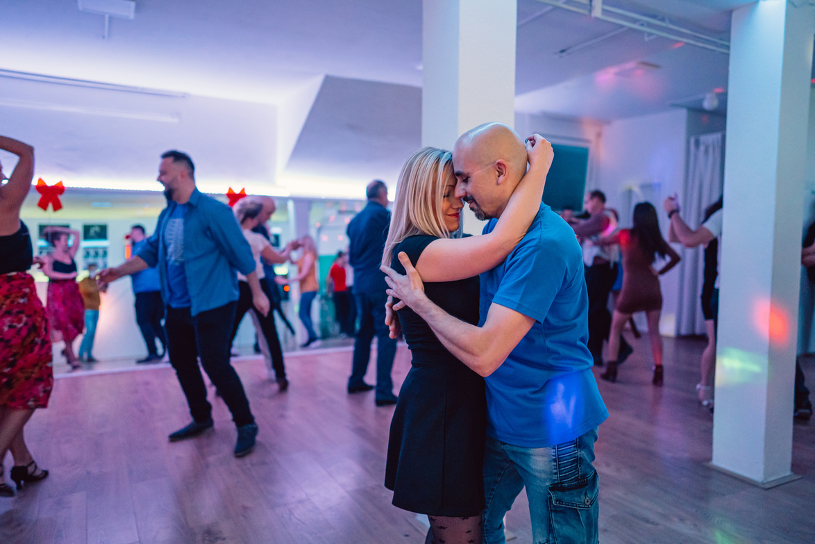 Couple dancing salsa at the party
